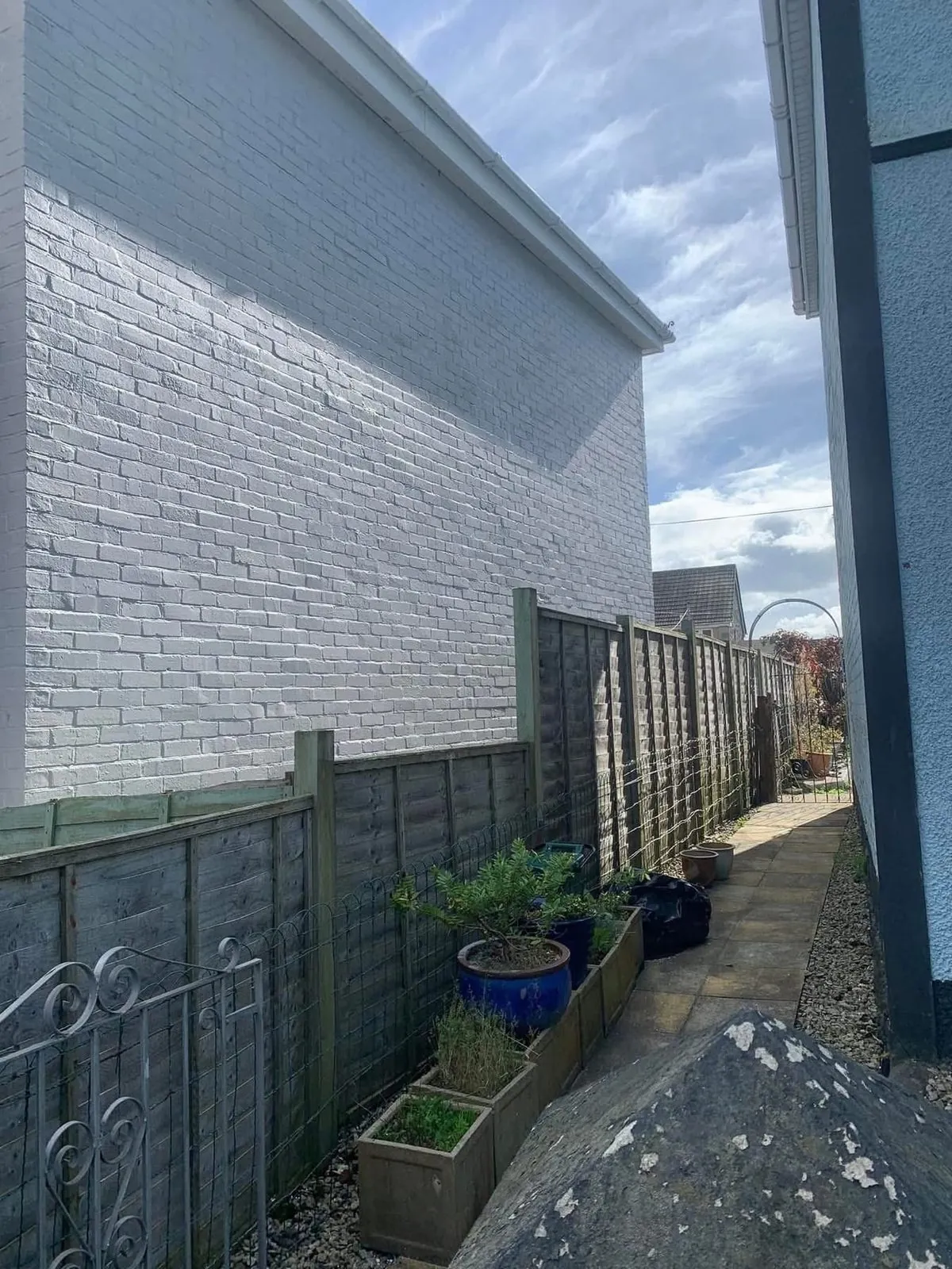 Freshly painted brick wall after preparation and masonry paint in Tintagel