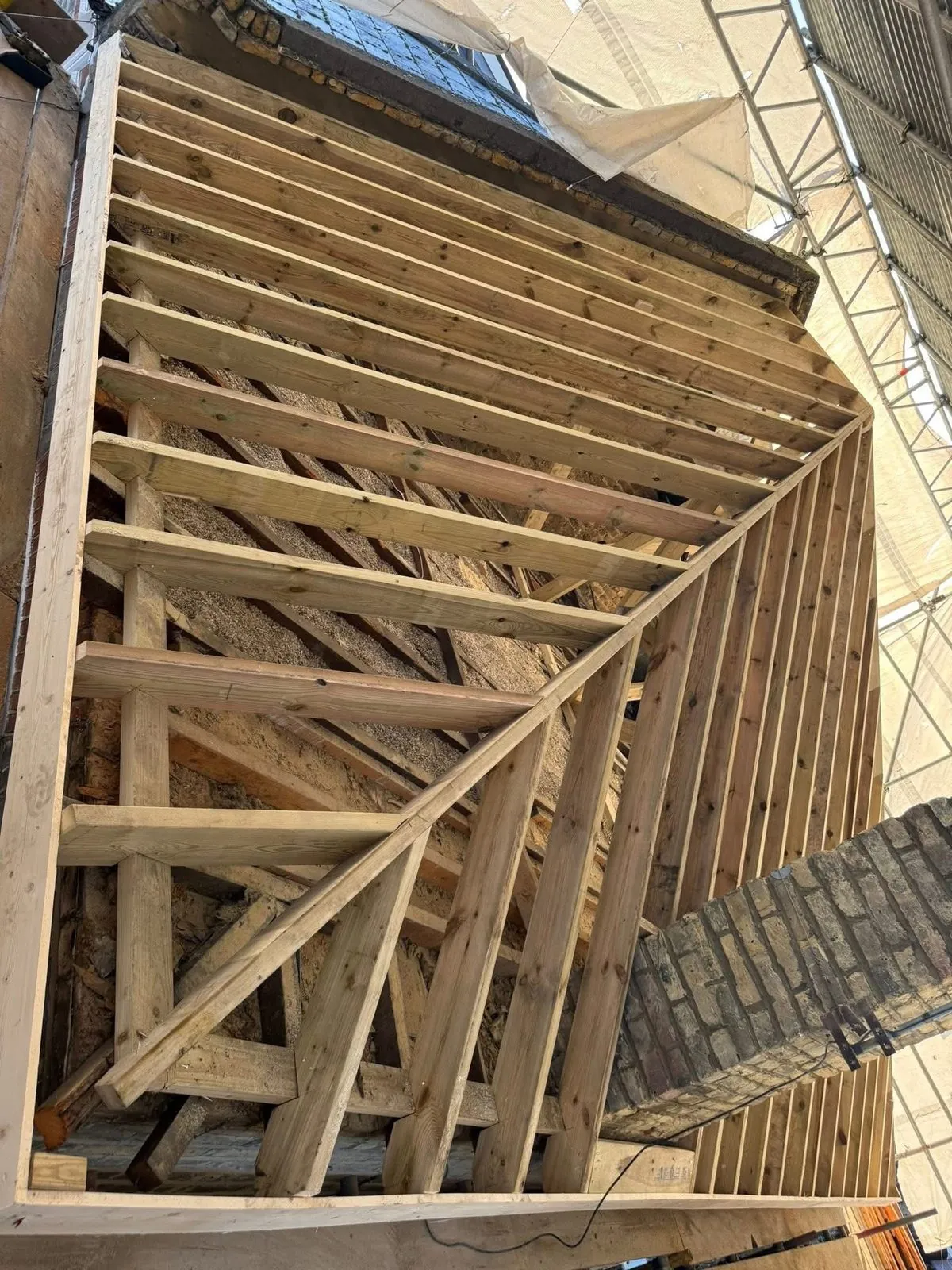 New roof timbers and rafters during a re-roof in Tintagel